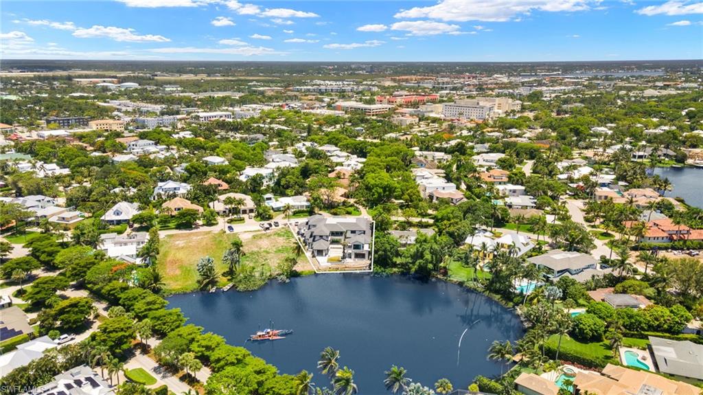 616 Bougainvillea Road Naples, FL 34102 - Photo 20 of 21 Aerial view of property and surrounding area with a nearby body of water