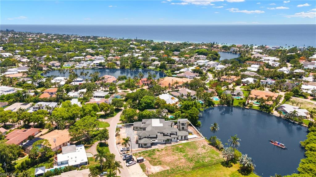 616 Bougainvillea Road Naples, FL 34102 - Photo 21 of 21 View of property location with a large body of water and nearby suburban area