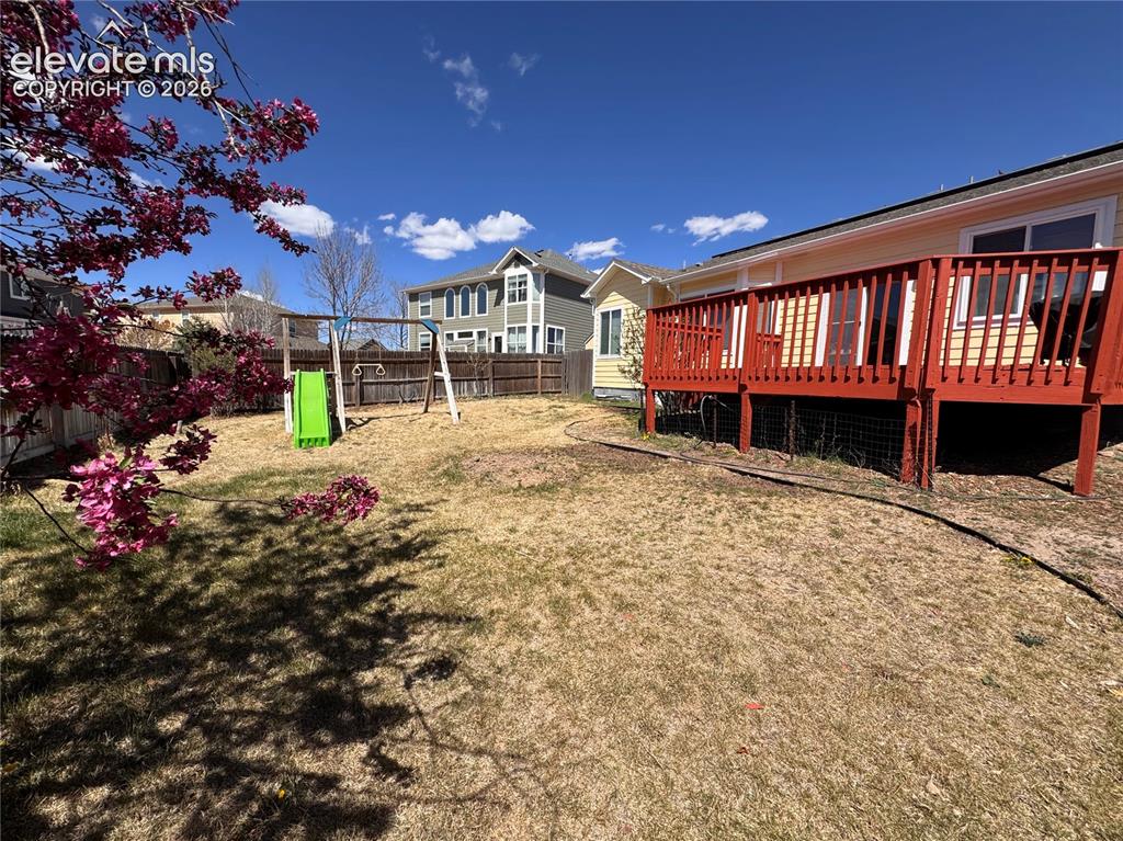 9362 St.George Road Peyton, CO 80831 - Photo 29 of 32 a view of a house with a yard