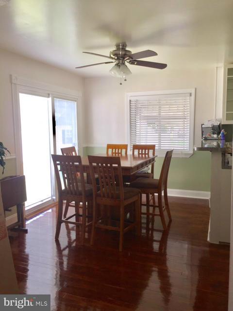 2763 Kirkleigh Road Baltimore, MD 21222 - Photo 8 of 16 a view of a dining room with furniture window and wooden floor
