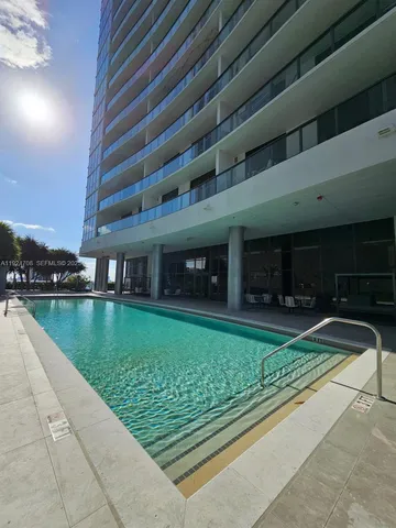 a view of a backyard with palm trees