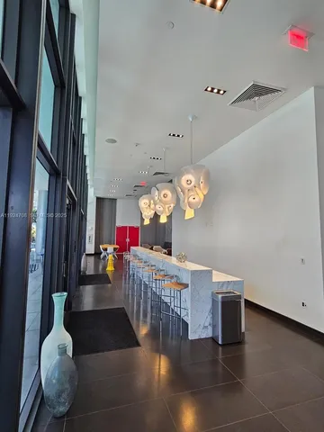 a room with a couch and a rug