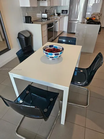 a kitchen with a stove and a refrigerator