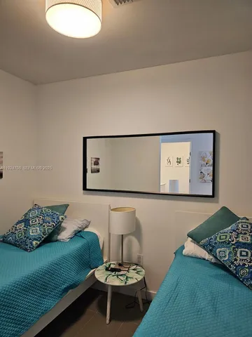 a bedroom with a bed and furniture