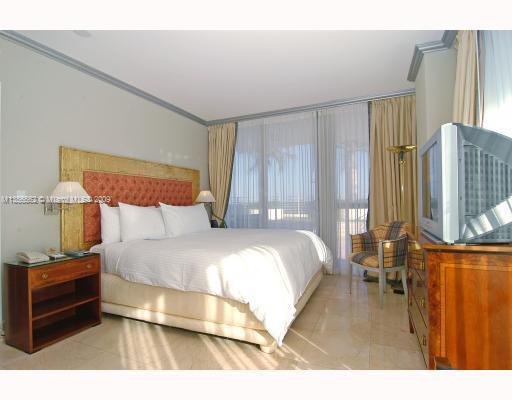 South of Fifth Miami Beach, FL 33139 - Photo 6 of 8 a bedroom with a bed and window