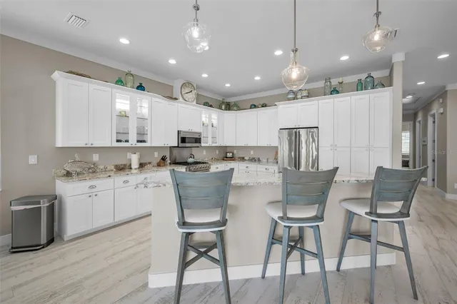 a view of a house with swimming pool and sitting area