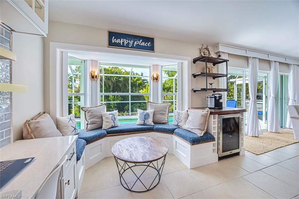 3700 Kent Drive Naples, FL 34112 - Photo 11 of 31 a living room with furniture and a large window