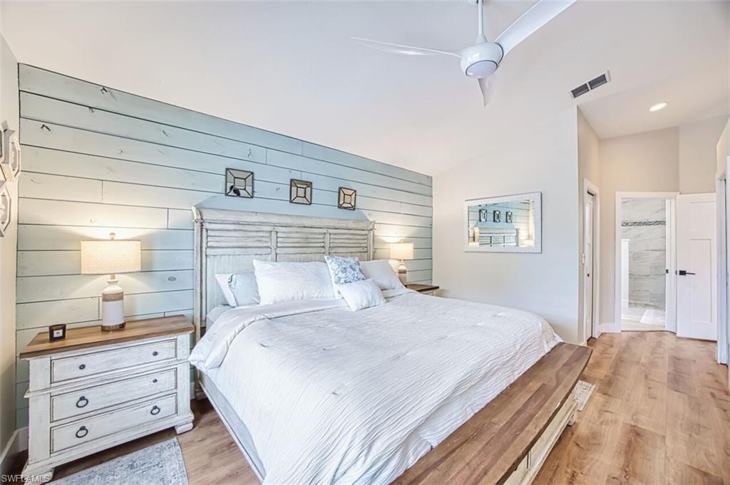 3700 Kent Drive Naples, FL 34112 - Photo 13 of 31 a bedroom with a bed and a window