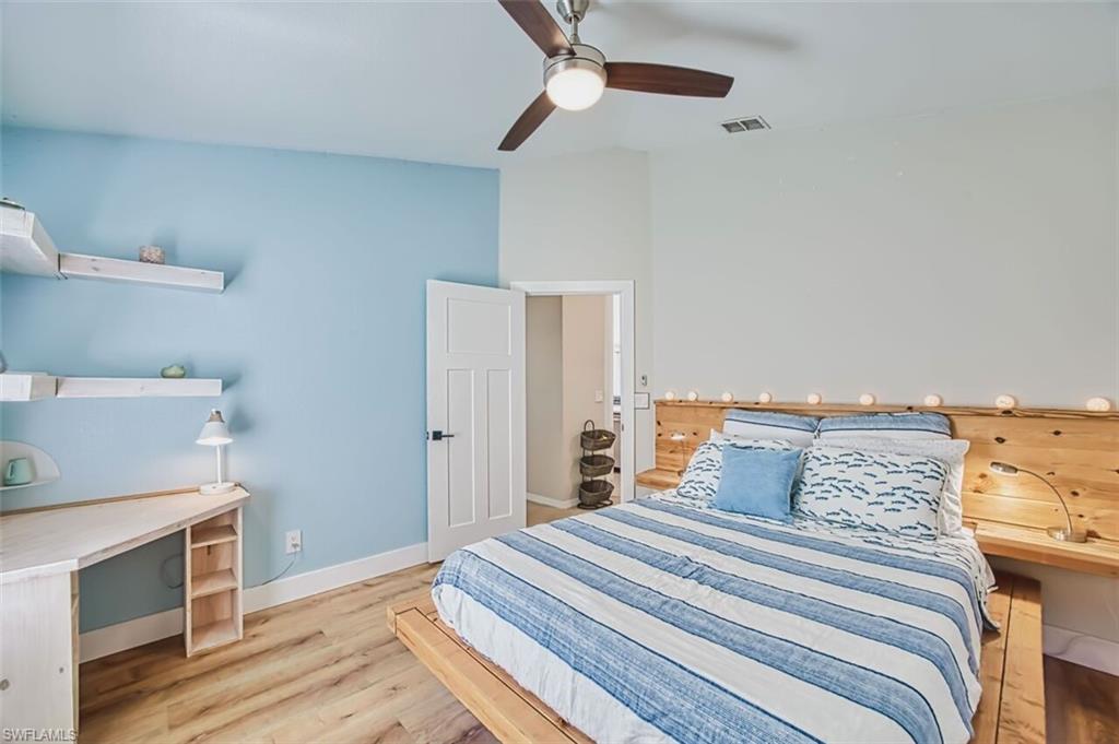 3700 Kent Drive Naples, FL 34112 - Photo 17 of 31 a bedroom with a bed and a flat screen tv