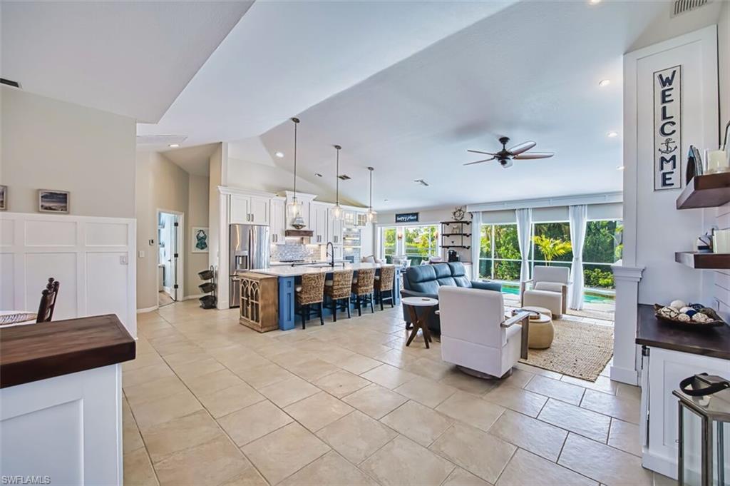 3700 Kent Drive Naples, FL 34112 - Photo 2 of 31 a living room with furniture and large windows