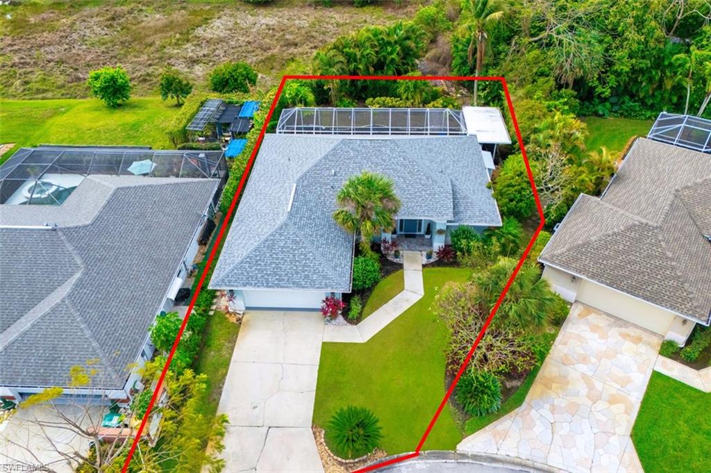 3700 Kent Drive Naples, FL 34112 - Photo 29 of 31 an aerial view of a house with a garden and swimming pool