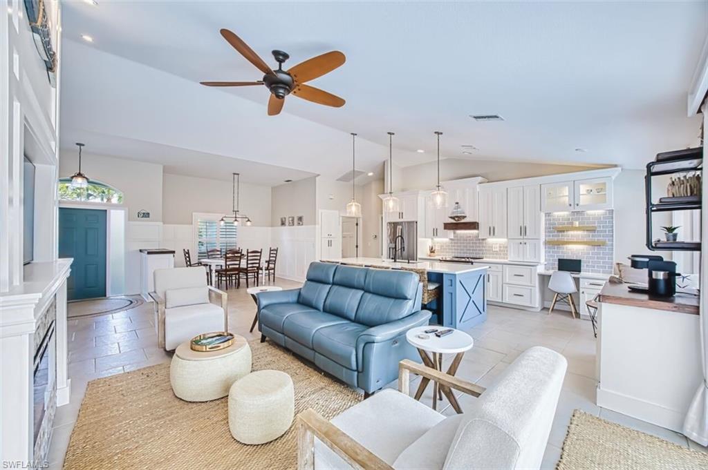 3700 Kent Drive Naples, FL 34112 - Photo 3 of 31 a living room with furniture kitchen view and a chandelier