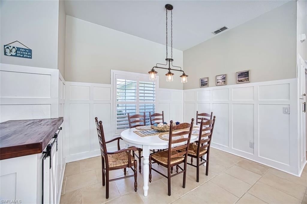 3700 Kent Drive Naples, FL 34112 - Photo 6 of 31 a view of a dining room with furniture