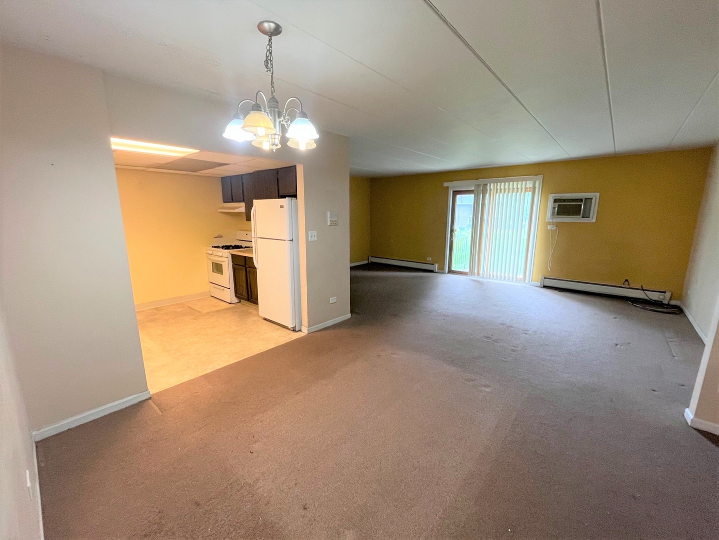 264 East Bailey Road, Unit G Naperville, IL 60565 - Photo 3 of 9 a view of a livingroom with a chandelier
