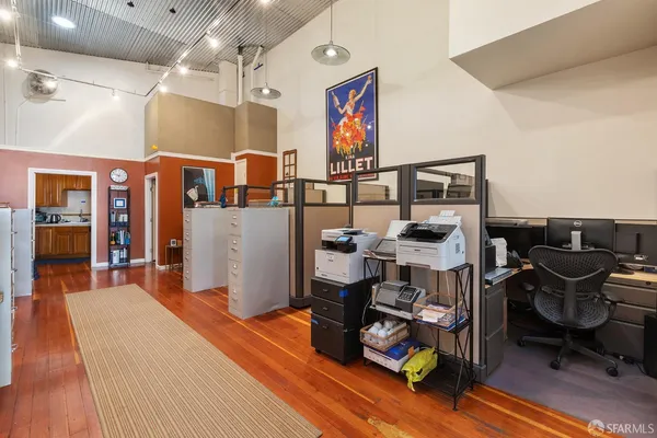 a bedroom with furniture and a gym machine