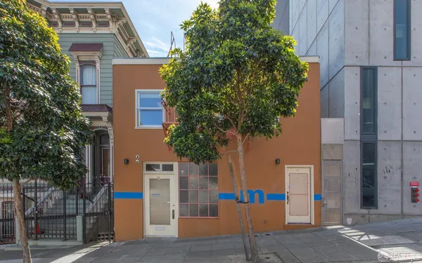 a front view of a building with street view