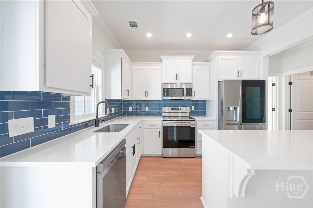 47 Ennis Road Pembroke, GA 31321 - Photo 11 of 35 Full tile backsplash and pantry.