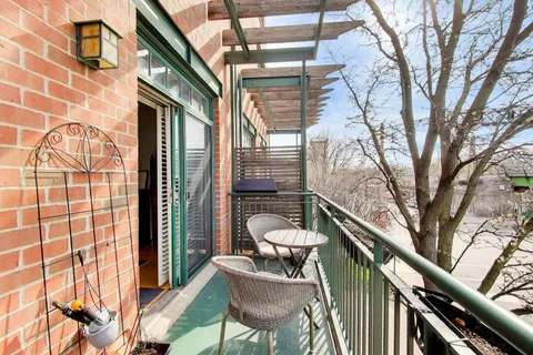 a balcony view with a seating space