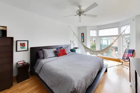 a bed room with a bed and a chandelier