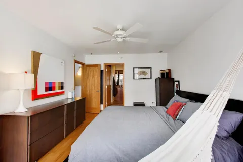 a bed room with a bed and a mirror