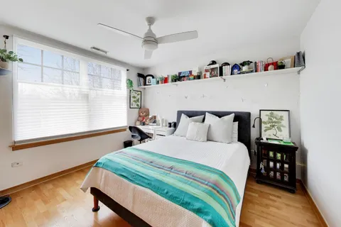a bedroom with bed and a window