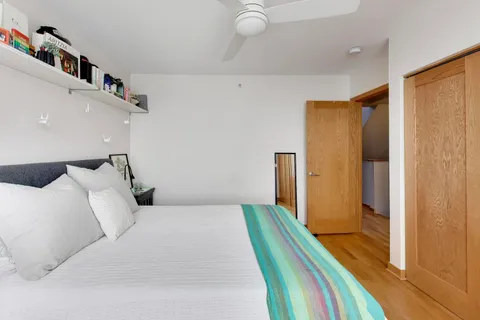 a bedroom with a bed and a walk in closet