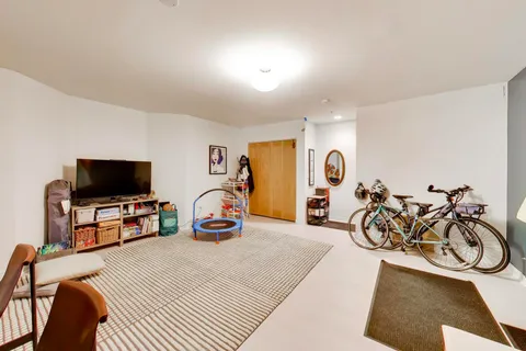 a view of a livingroom with furniture and a flat screen tv