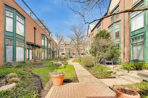 a front view of a building with outdoor seating