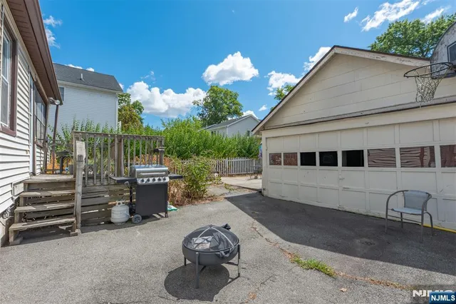 a view of backyard and tree