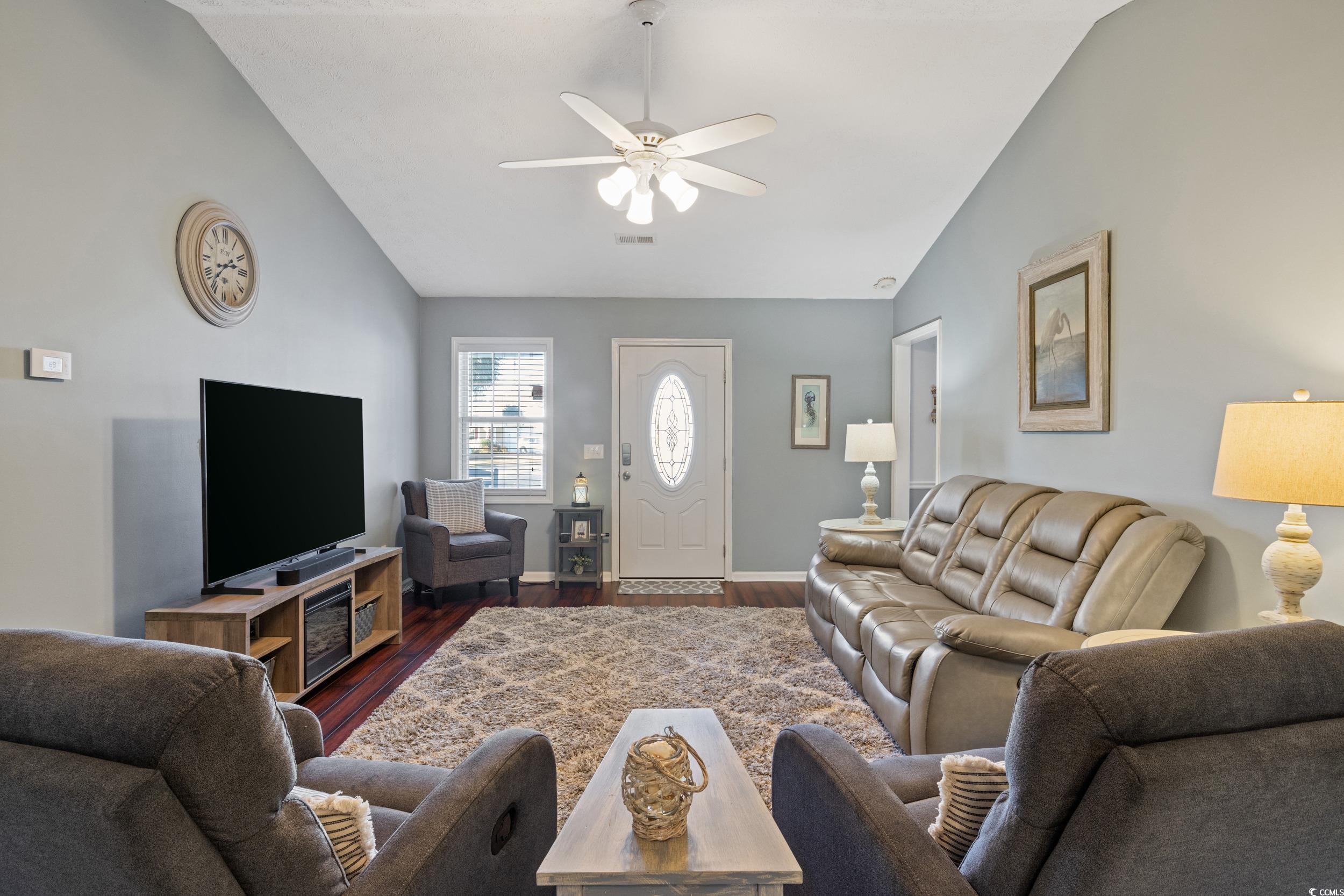 9605 Sullivan Drive Murrells Inlet, SC 29576 - Photo 14 of 40 Living room featuring ceiling fan, dark hardwood /