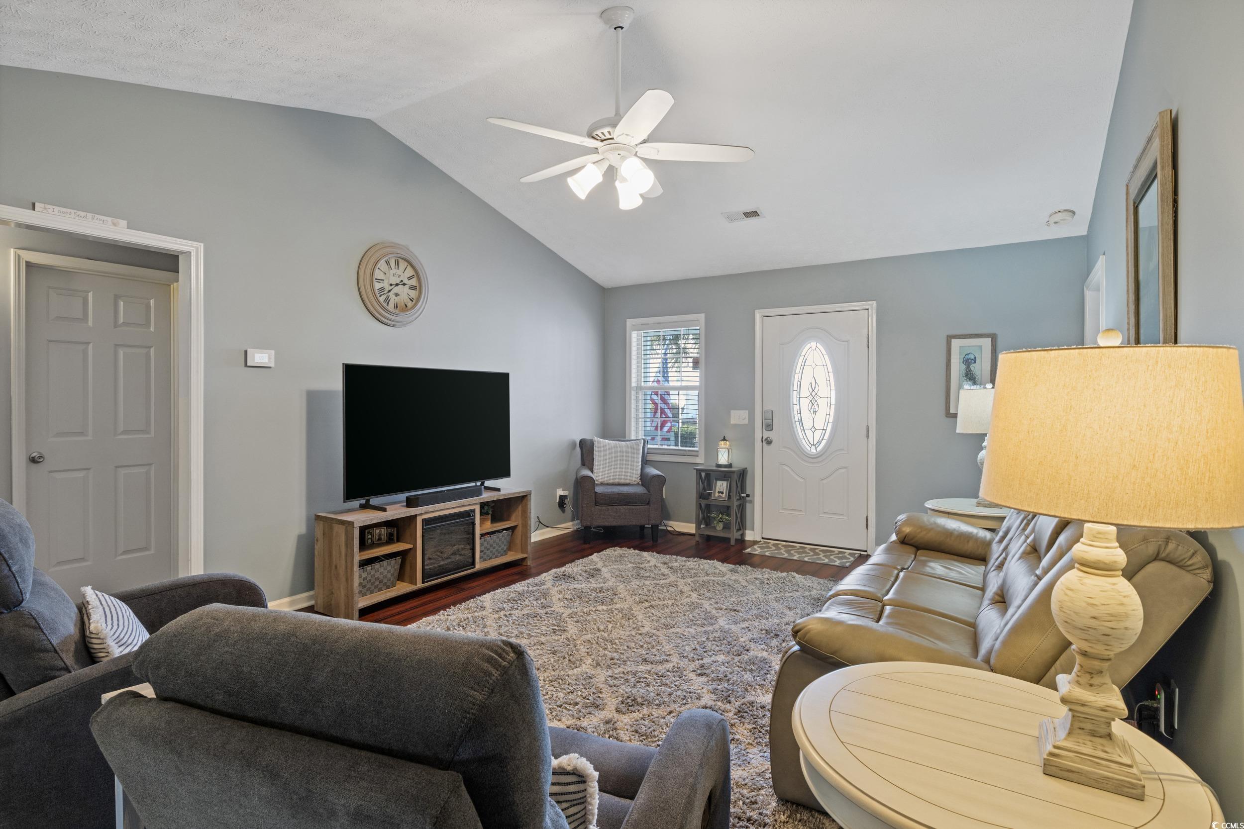 9605 Sullivan Drive Murrells Inlet, SC 29576 - Photo 15 of 40 Living room featuring ceiling fan, wood-type floor