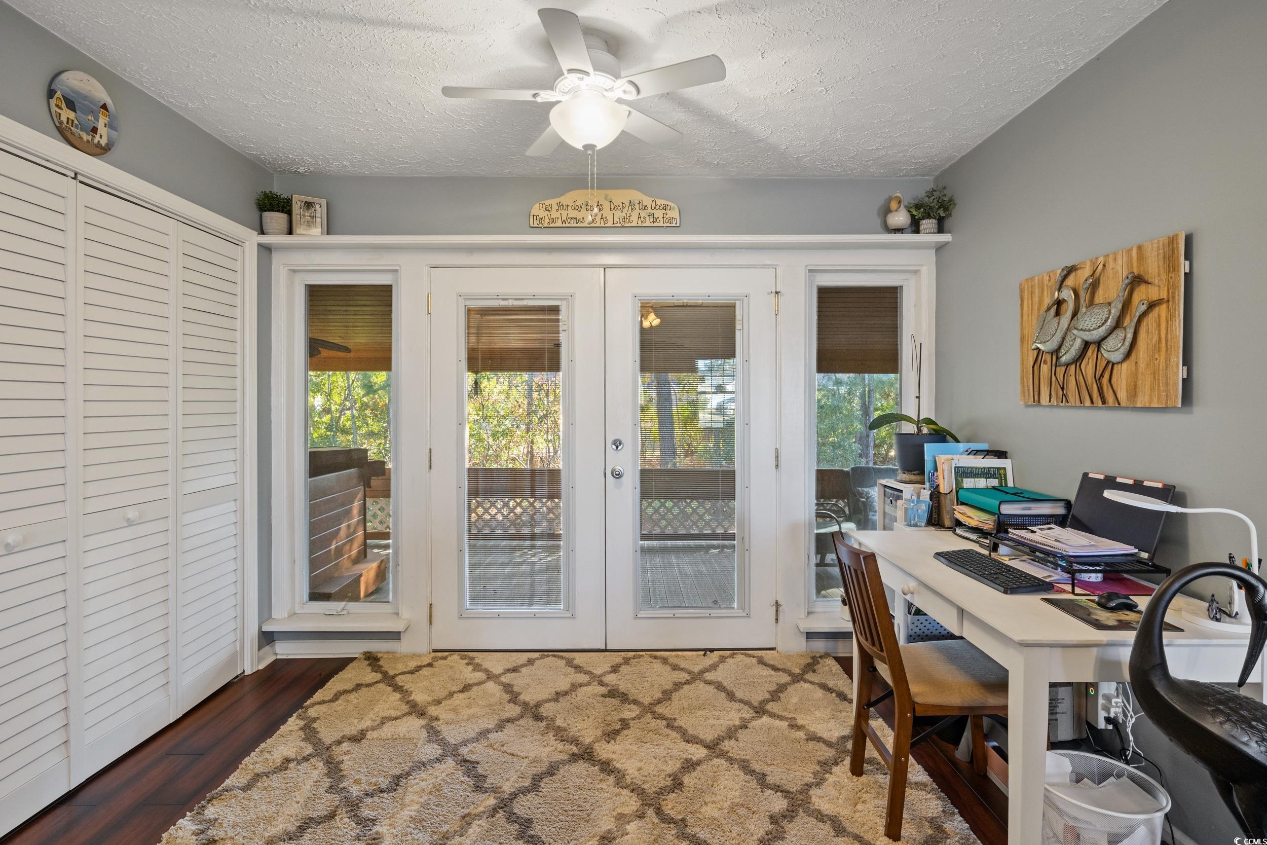 9605 Sullivan Drive Murrells Inlet, SC 29576 - Photo 16 of 40 Home office with dark hardwood / wood-style floori