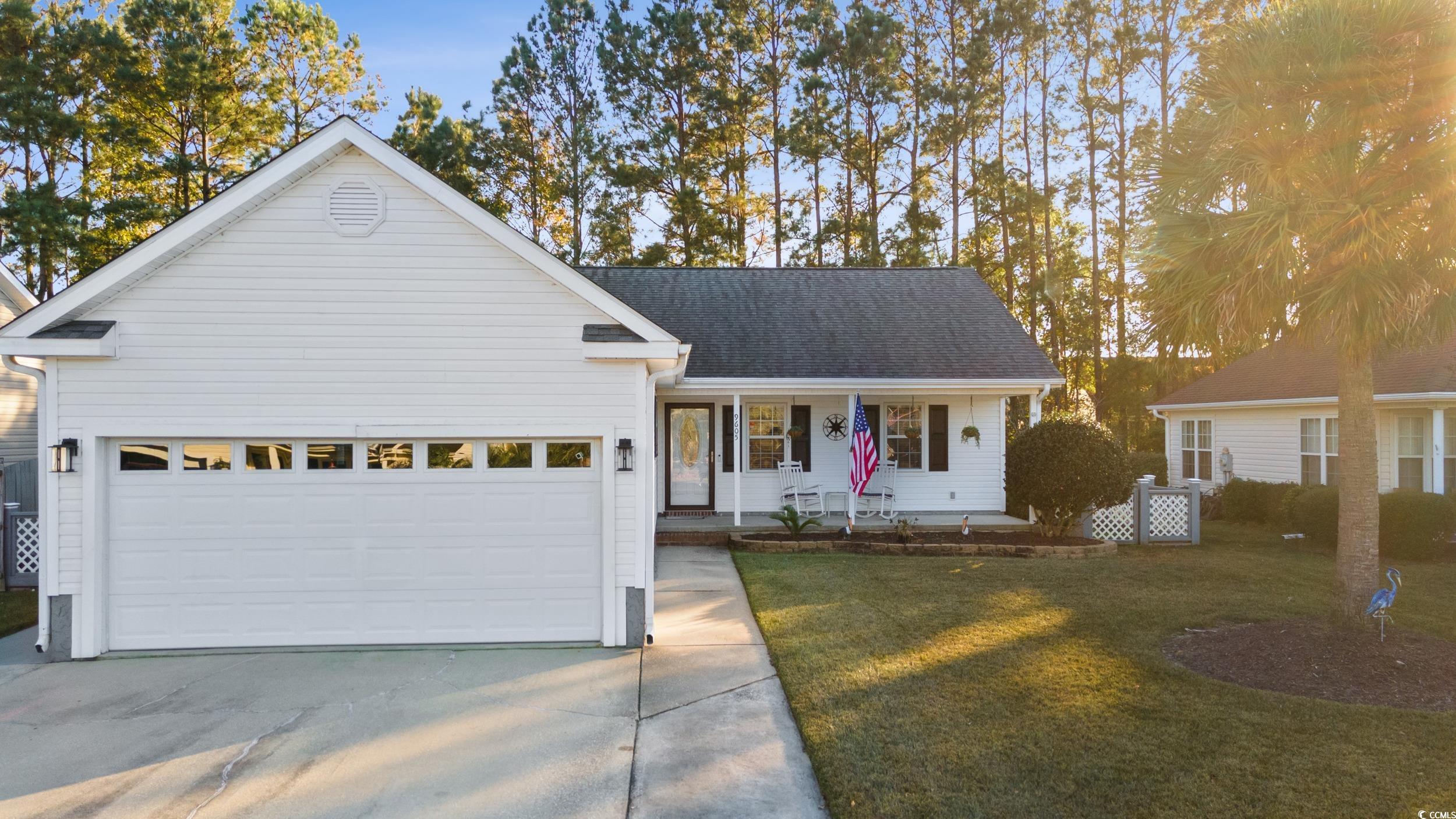 9605 Sullivan Drive Murrells Inlet, SC 29576 - Photo 2 of 40 View of front of home with a garage, covered porch