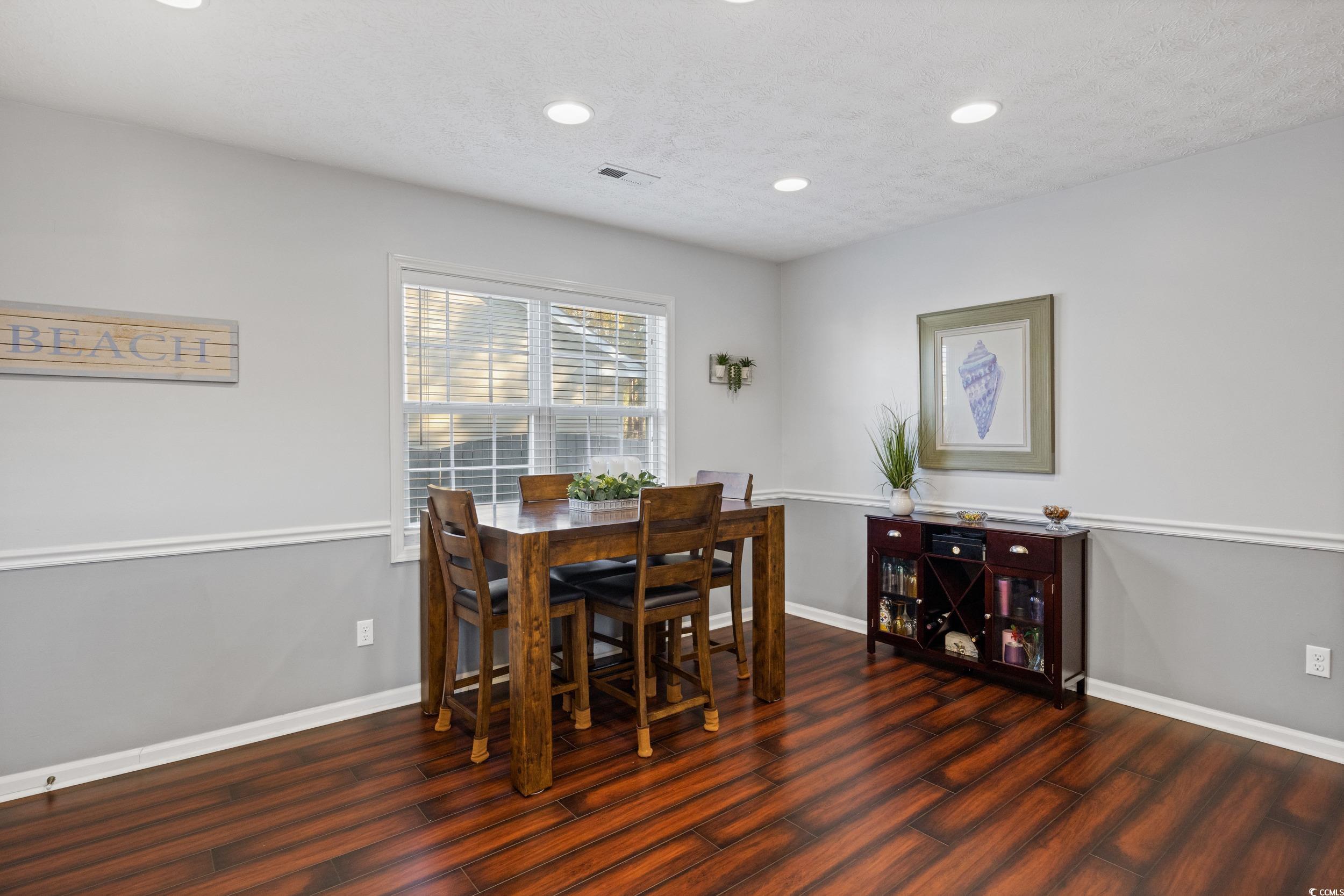 9605 Sullivan Drive Murrells Inlet, SC 29576 - Photo 23 of 40 Dining room featuring dark hardwood / wood-style f