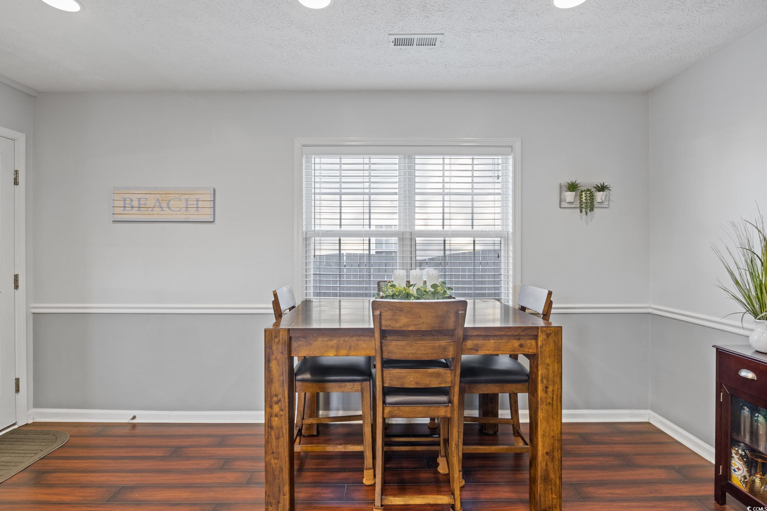 9605 Sullivan Drive Murrells Inlet, SC 29576 - Photo 24 of 40 Dining area featuring dark hardwood / wood-style f