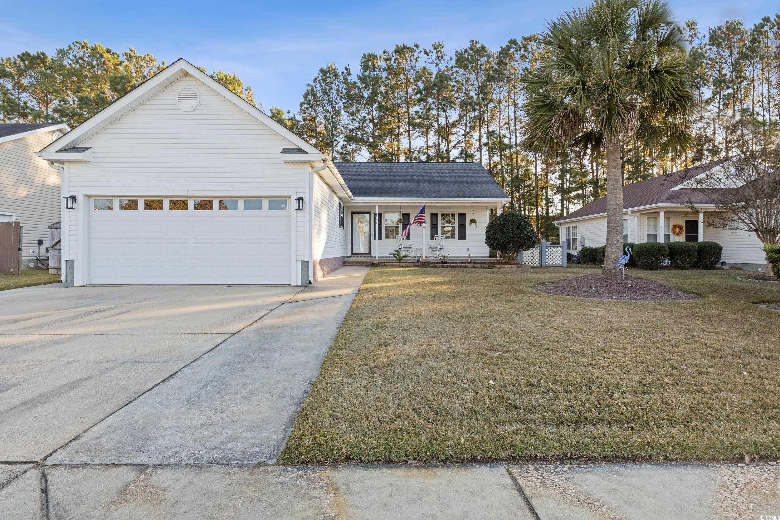9605 Sullivan Drive Murrells Inlet, SC 29576 - Photo 3 of 40 View of front of property with covered porch, a fr
