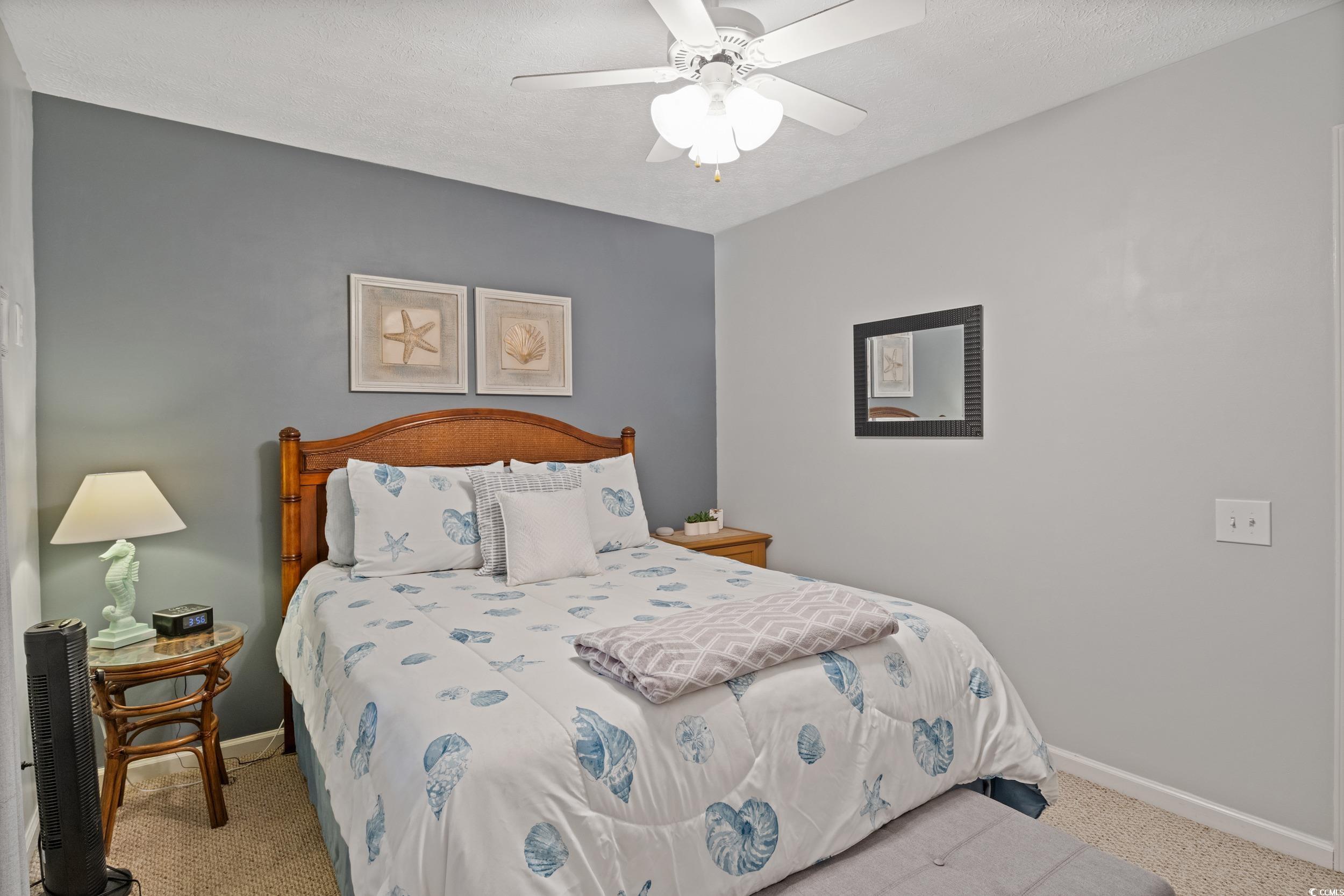 9605 Sullivan Drive Murrells Inlet, SC 29576 - Photo 31 of 40 Carpeted bedroom featuring ceiling fan