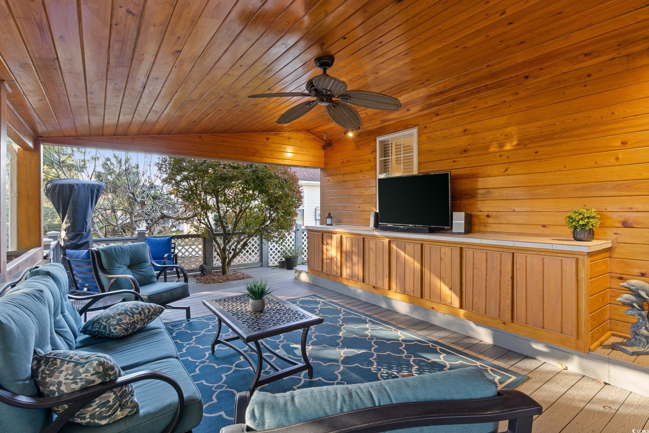 9605 Sullivan Drive Murrells Inlet, SC 29576 - Photo 34 of 40 View of patio with outdoor lounge area and ceiling