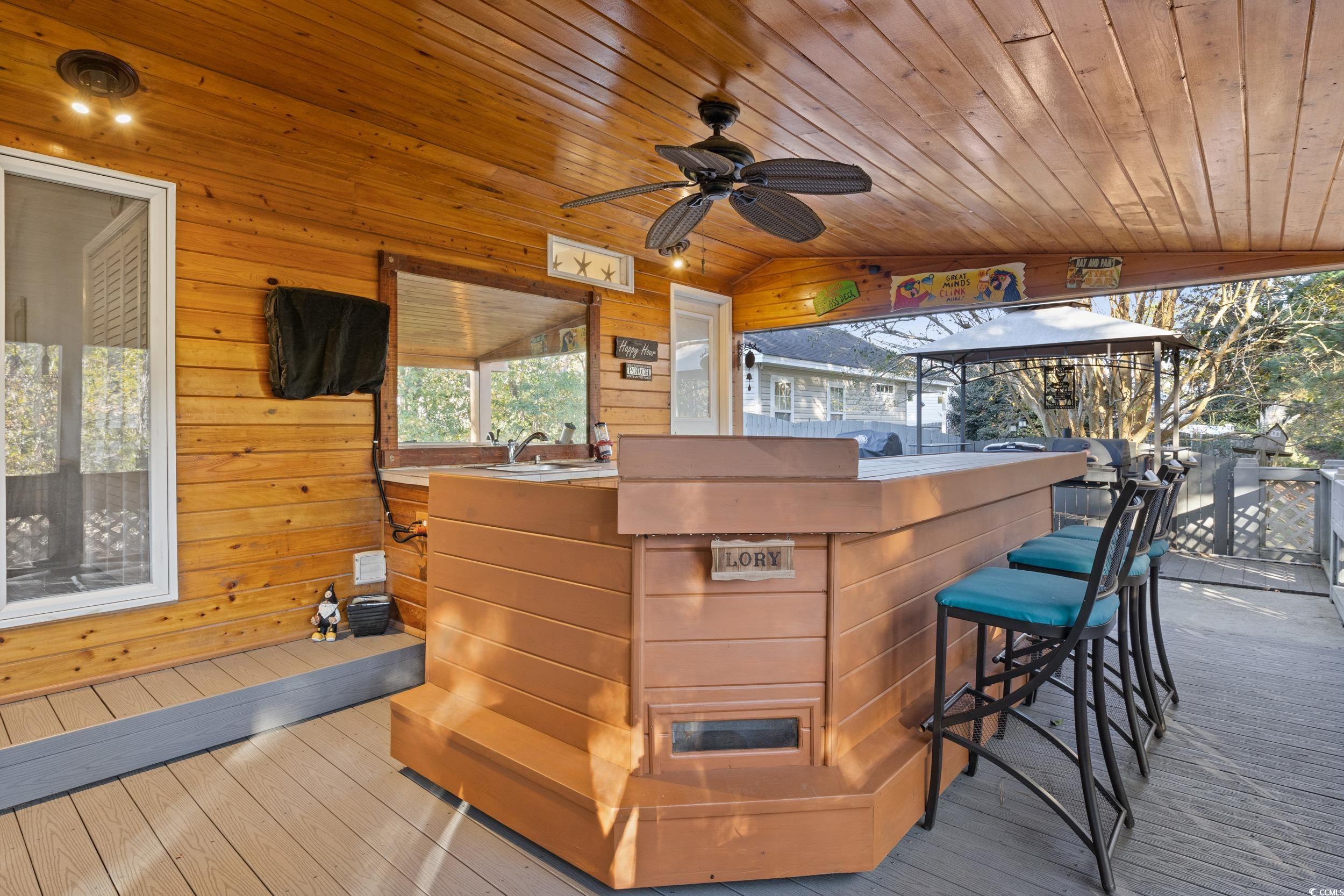 9605 Sullivan Drive Murrells Inlet, SC 29576 - Photo 35 of 40 Deck featuring exterior bar and ceiling fan