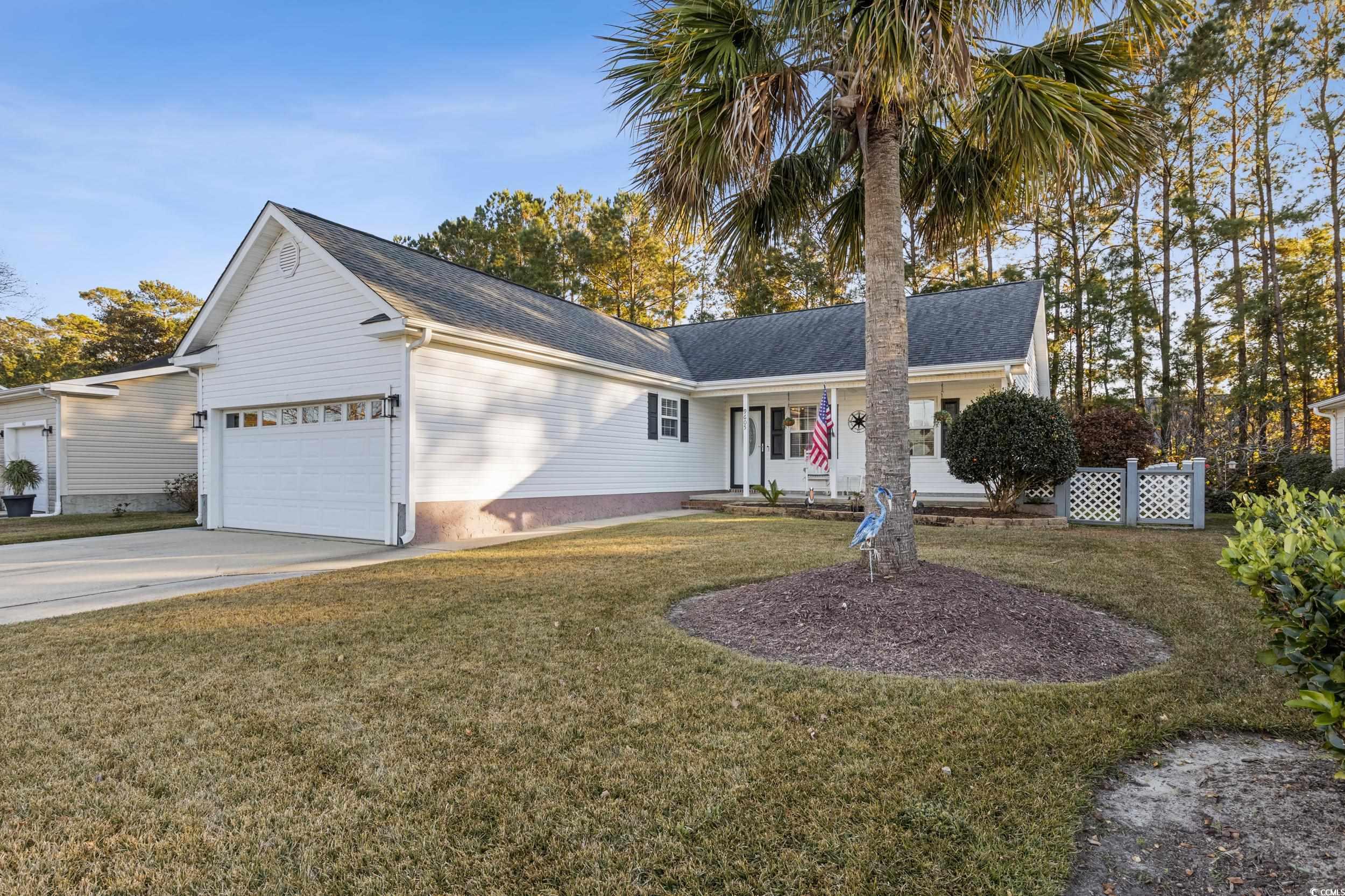 9605 Sullivan Drive Murrells Inlet, SC 29576 - Photo 4 of 40 Single story home featuring a front yard, a porch,