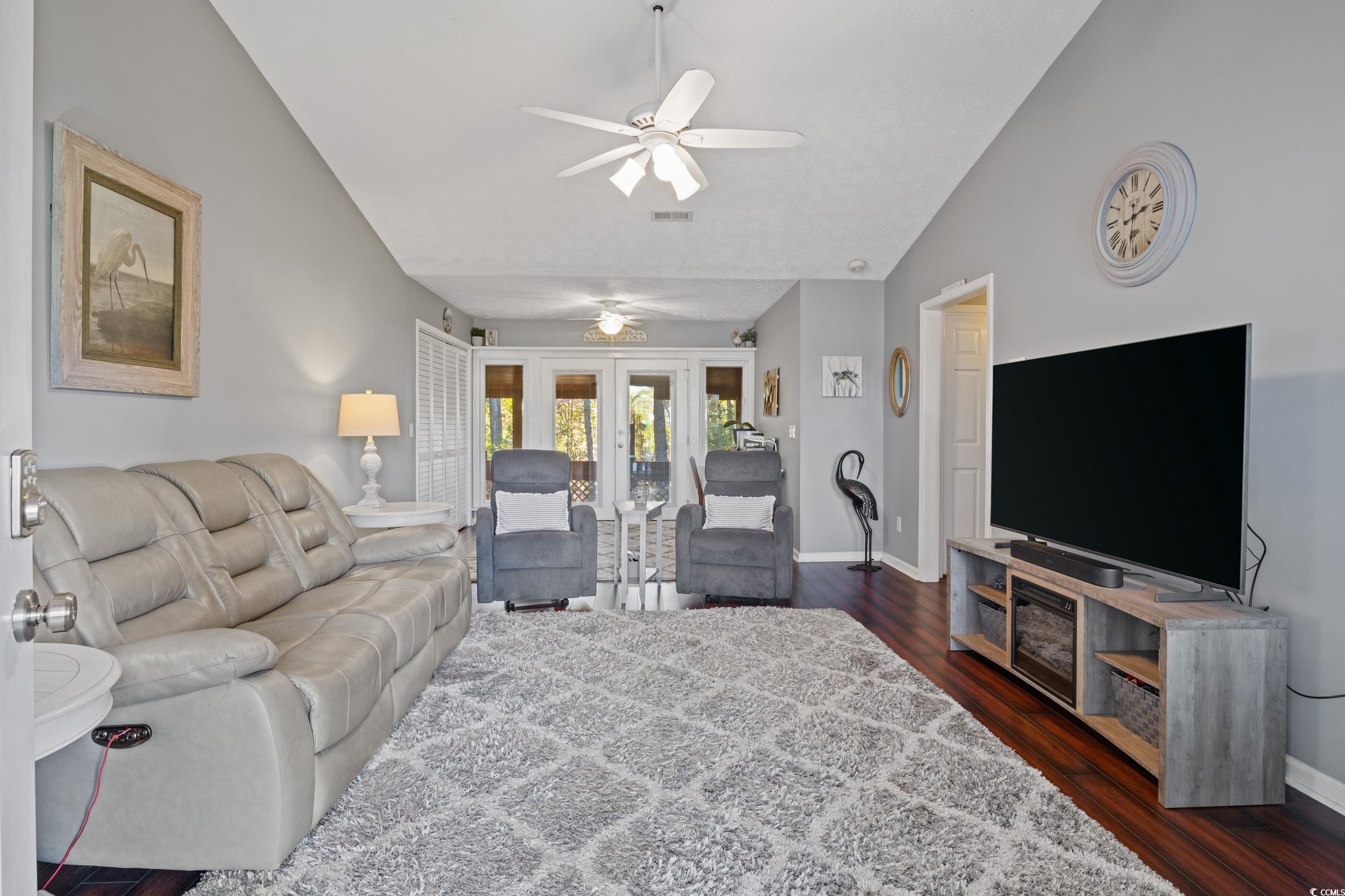9605 Sullivan Drive Murrells Inlet, SC 29576 - Photo 8 of 40 Living room with french doors, ceiling fan, dark h