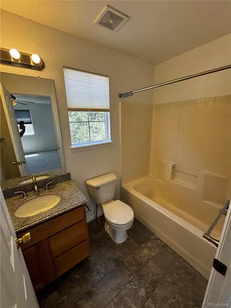 an empty room with closet area