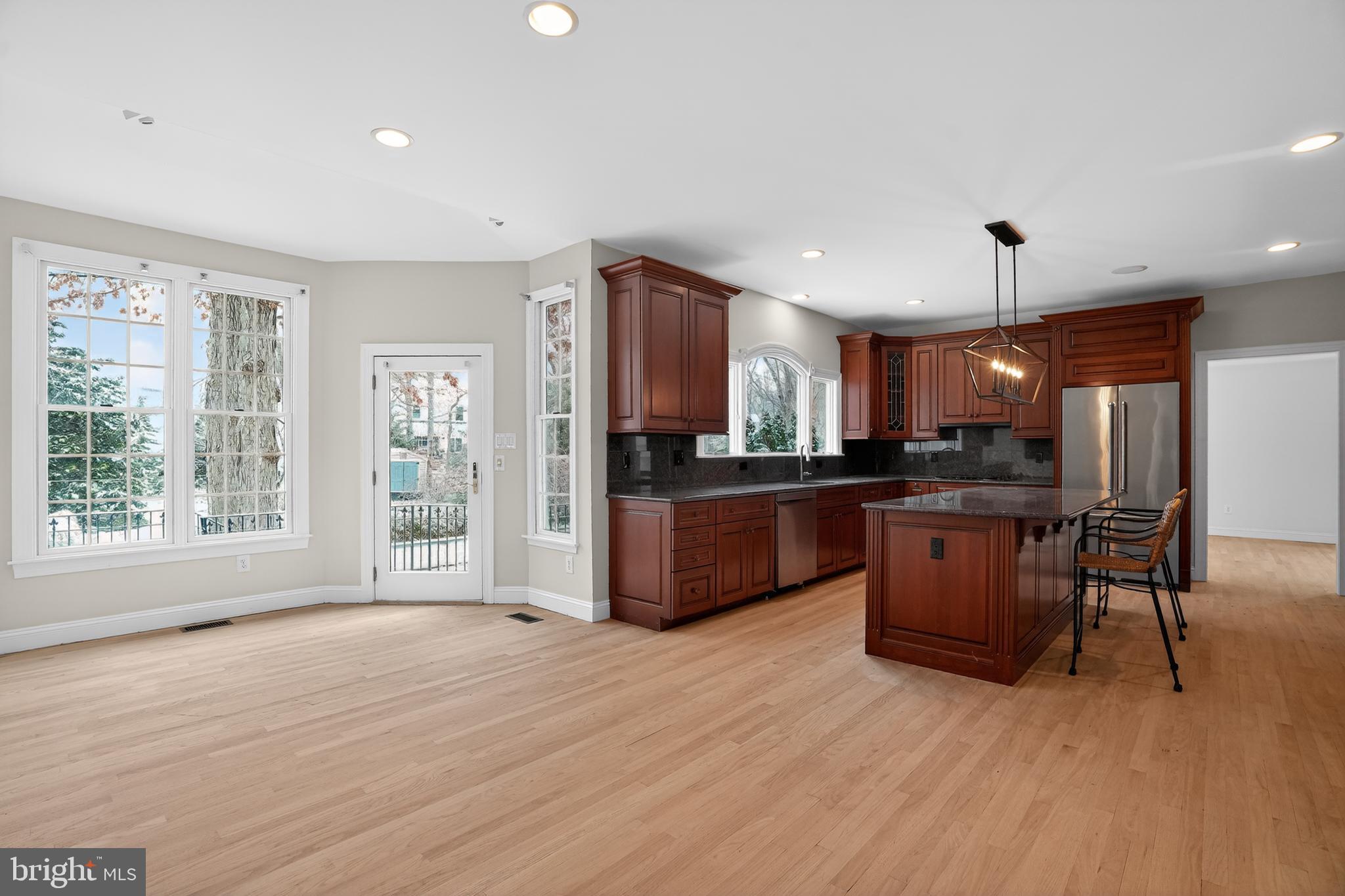 35 Stanwyck Road Mount Laurel, NJ 08054 - Photo 21 of 89 a open kitchen with stainless steel appliances granite countertop a refrigerator a sink dishwasher a stove and a dining table with wooden floor