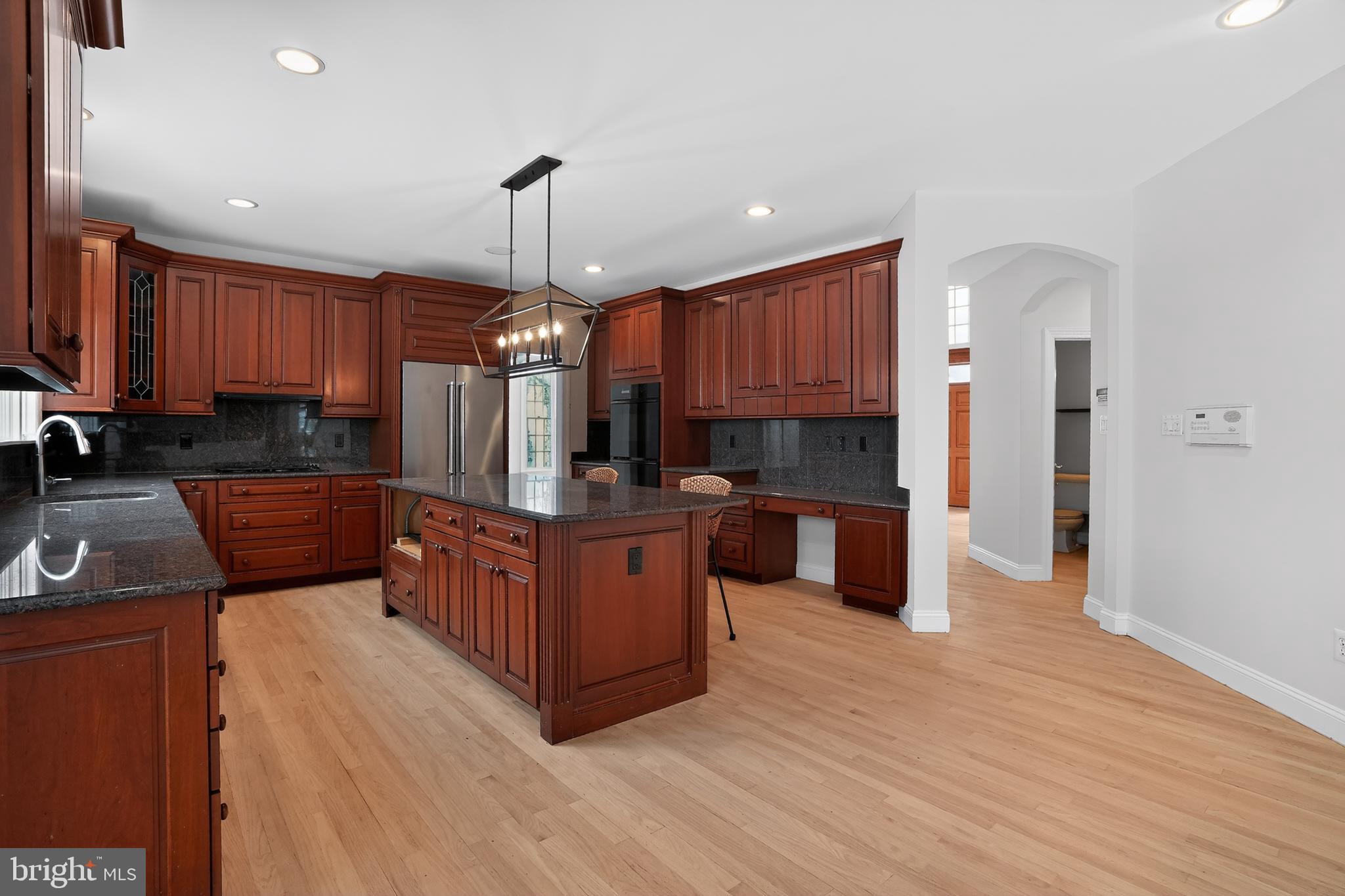 35 Stanwyck Road Mount Laurel, NJ 08054 - Photo 22 of 89 a kitchen with stainless steel appliances wooden cabinets a stove a sink and a refrigerator
