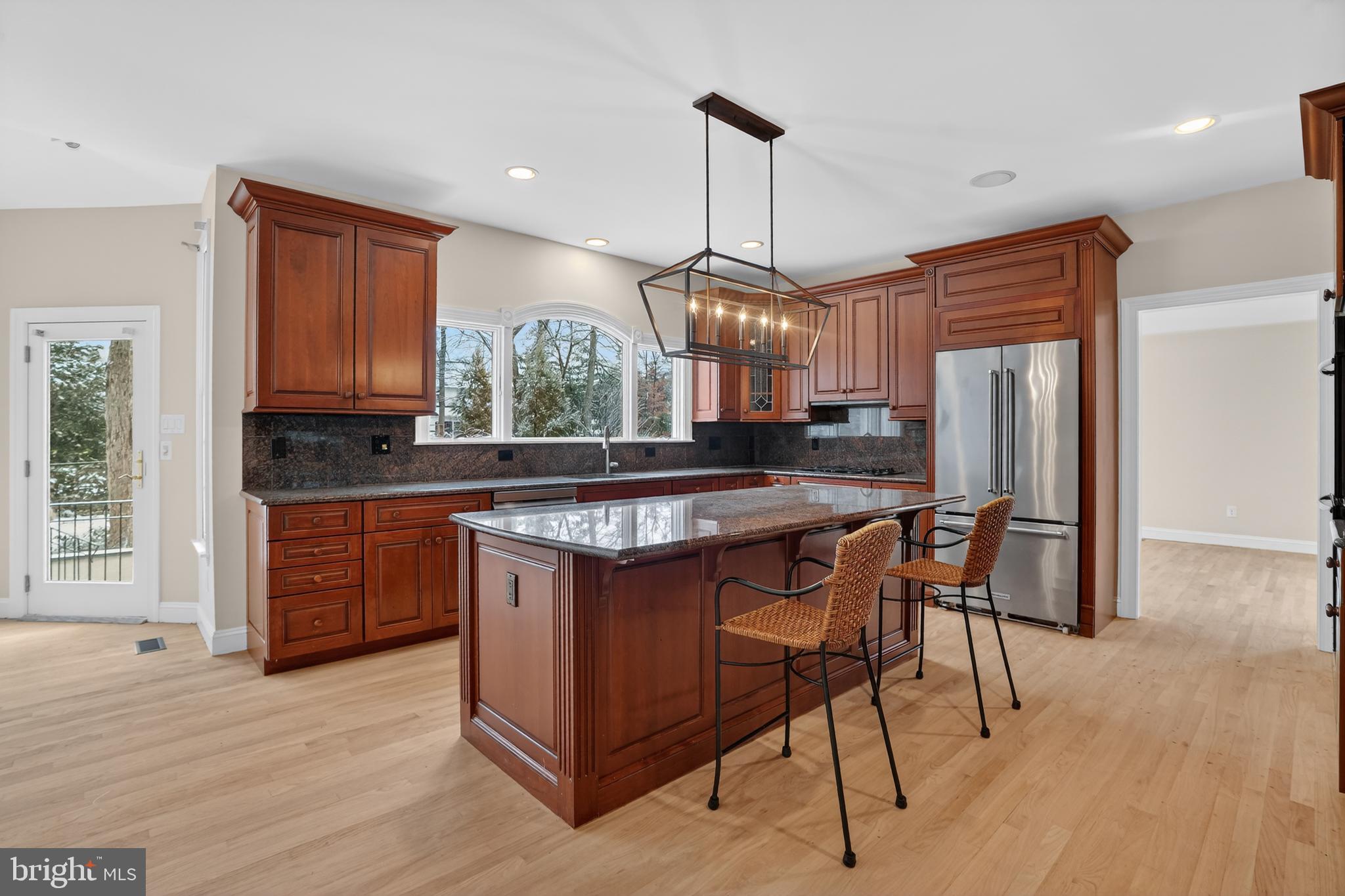 35 Stanwyck Road Mount Laurel, NJ 08054 - Photo 23 of 89 a kitchen with stainless steel appliances granite countertop a stove a sink dishwasher a refrigerator and wooden cabinets with wooden floor