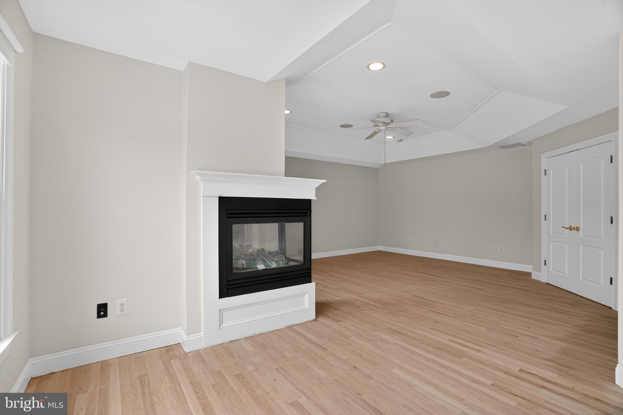 35 Stanwyck Road Mount Laurel, NJ 08054 - Photo 31 of 89 wooden floor in an empty room with a fireplace