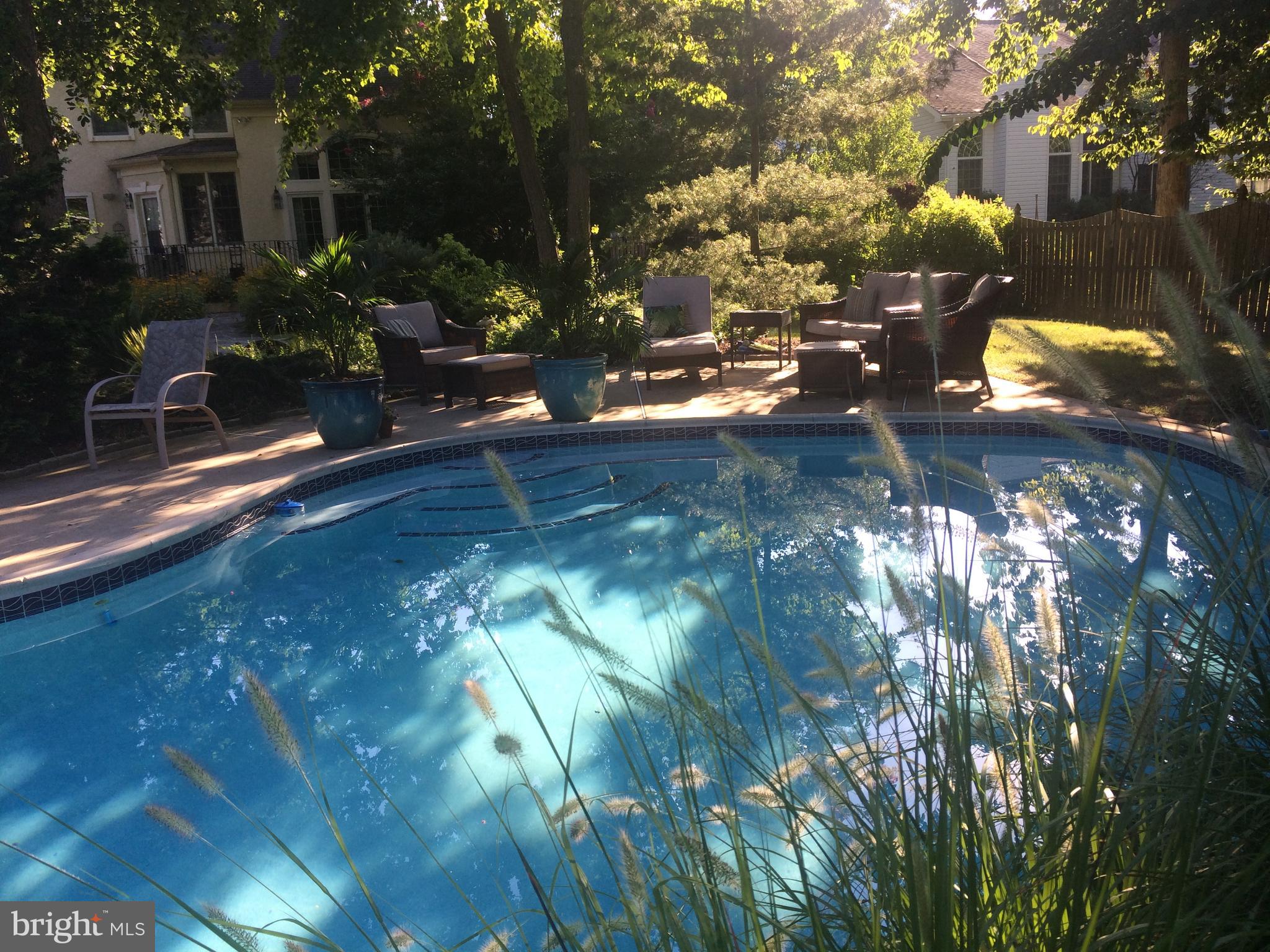 35 Stanwyck Road Mount Laurel, NJ 08054 - Photo 69 of 89 a backyard of a house with table and chairs under an umbrella