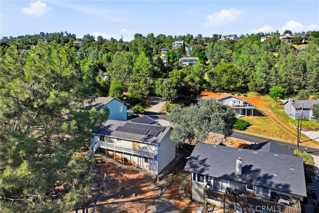 18685 Oak Grove Road Hidden Valley Lake, CA 95467 - Photo 40 of 52 an aerial view of a house with a yard fire pit and outdoor seating
