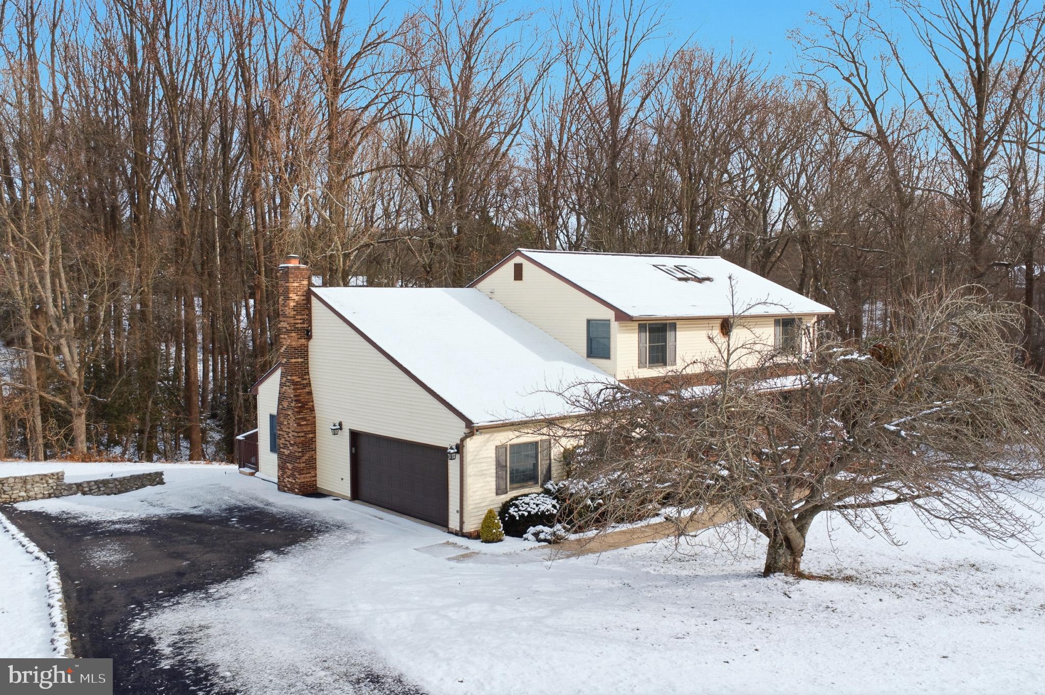 1290 Whirl A Way Court Gambrills, MD 21054 - Photo 12 of 111 a view of a house with a yard covered with snow in the yard