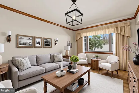 a kitchen with a refrigerator a sink and cabinets